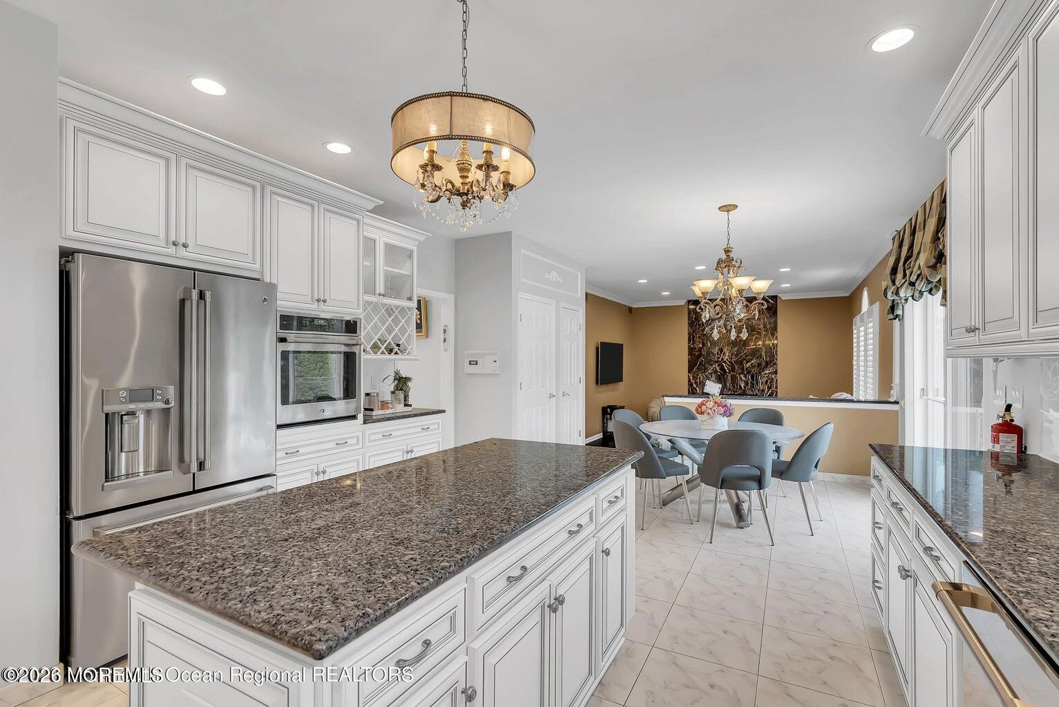 7 MacKenzie Road Eatontown, NJ 07724 - Photo 17 of 40 a large kitchen with a table and chairs
