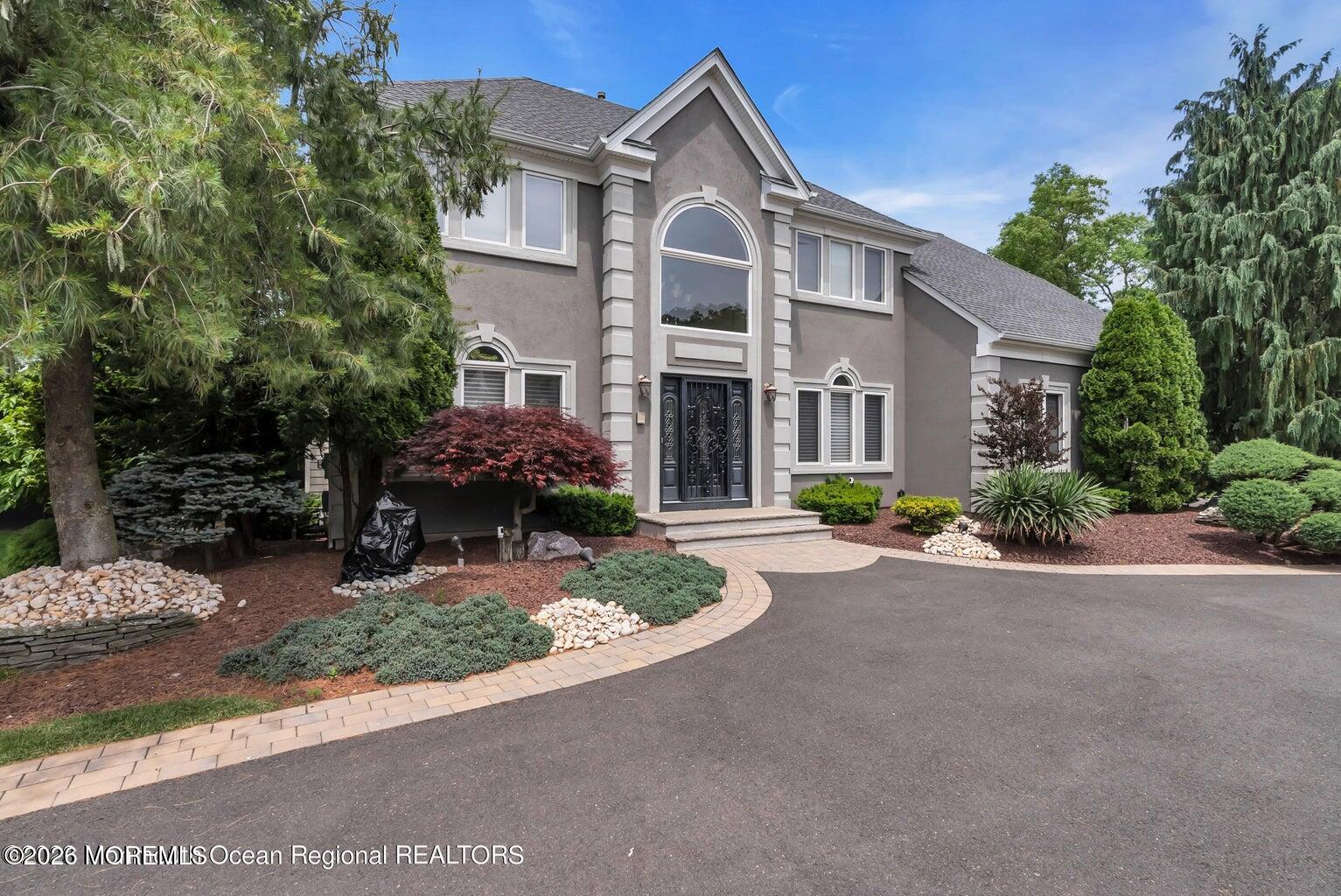 7 MacKenzie Road Eatontown, NJ 07724 - Photo 2 of 40 a front view of a house with porch and outdoor seating