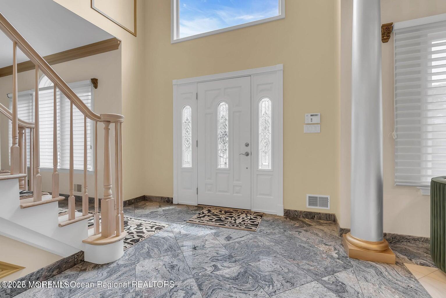 7 MacKenzie Road Eatontown, NJ 07724 - Photo 4 of 40 a view of an entryway with wooden floor