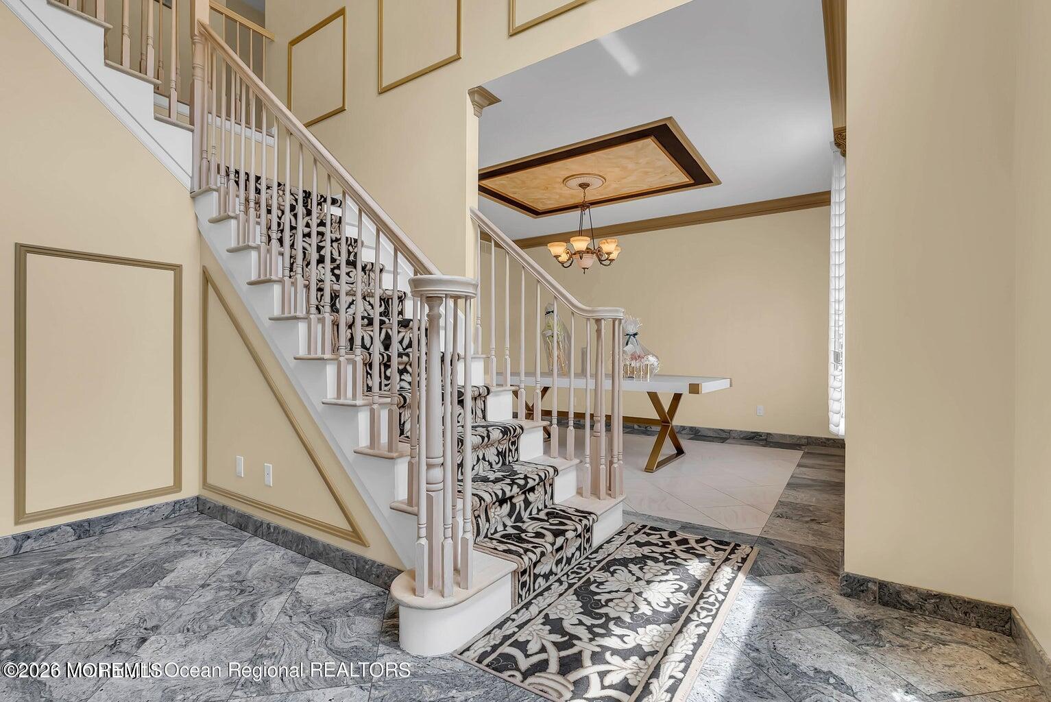 7 MacKenzie Road Eatontown, NJ 07724 - Photo 6 of 40 a view of entryway dining room and hall with wooden floor
