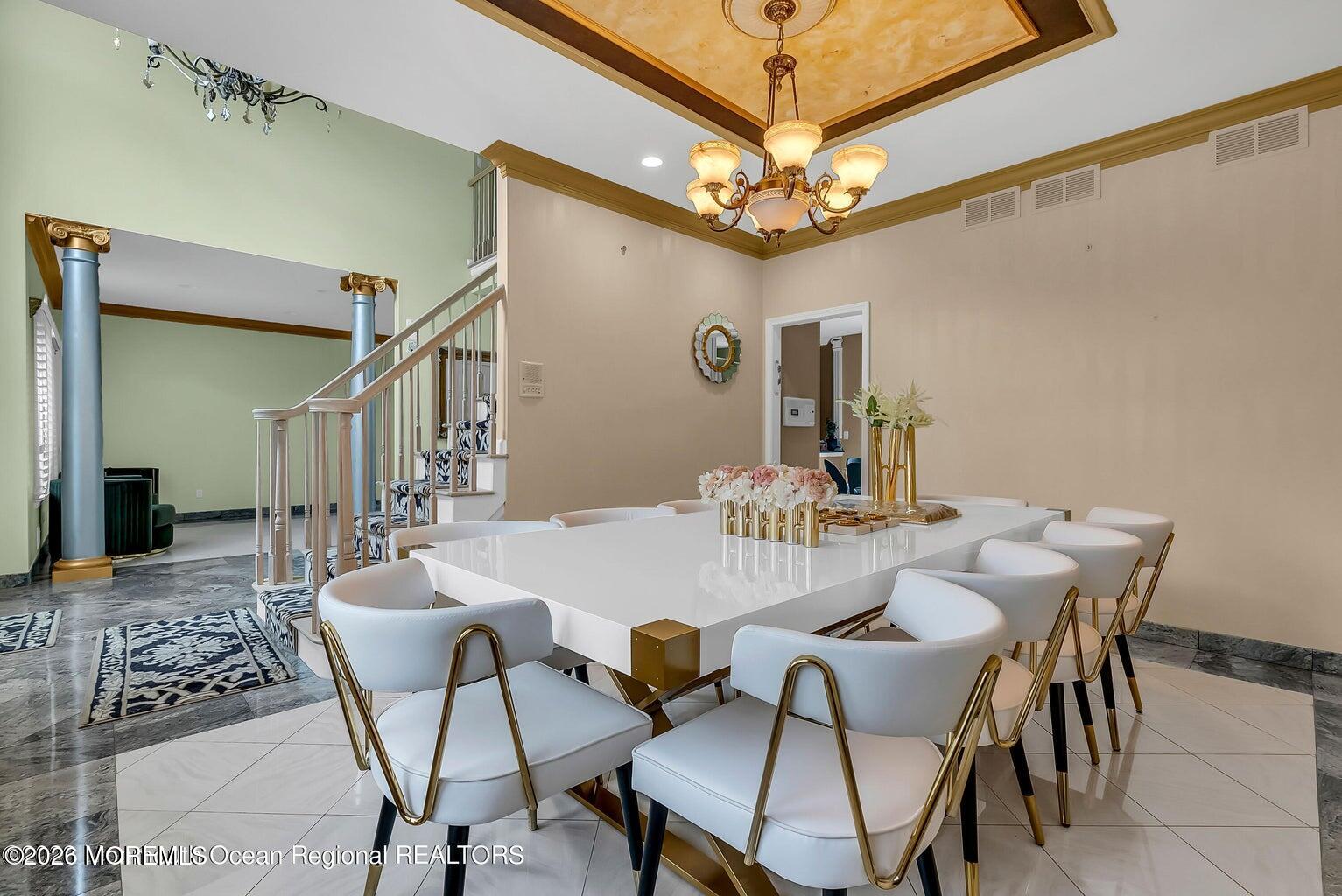 7 MacKenzie Road Eatontown, NJ 07724 - Photo 10 of 40 a view of a dining room with furniture and a chandelier
