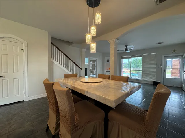 a dining room with furniture and window