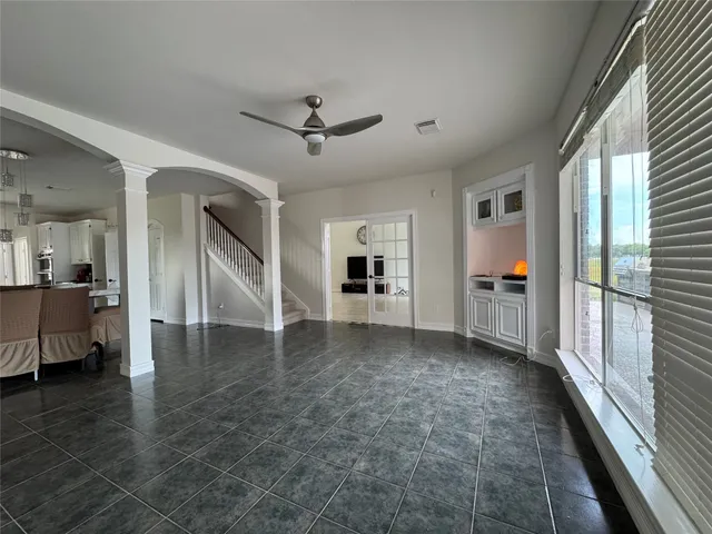 a view of a livingroom with furniture wooden floor and a window
