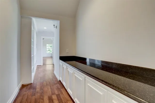 a hallway with wooden floor