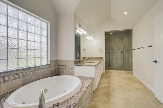 a bathroom with a bathtub and a sink