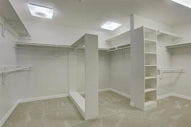 a view of an empty walk in closet