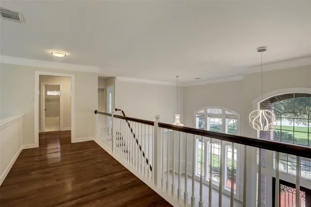 a view of an entryway with wooden floor