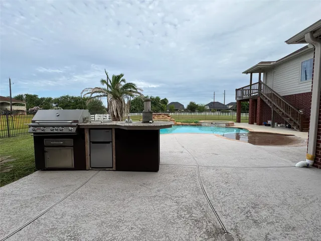 a view of a house with a yard and a large window