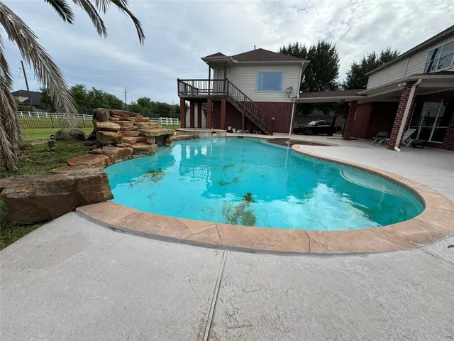 a view of a house with swimming pool