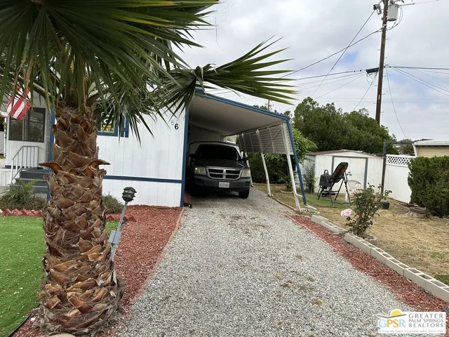 a view of front door and wooden staircase