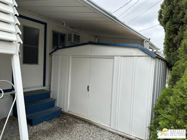 a front view of a house with large windows