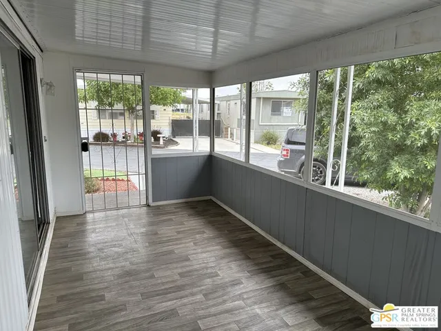 a view of a large window with wooden floor