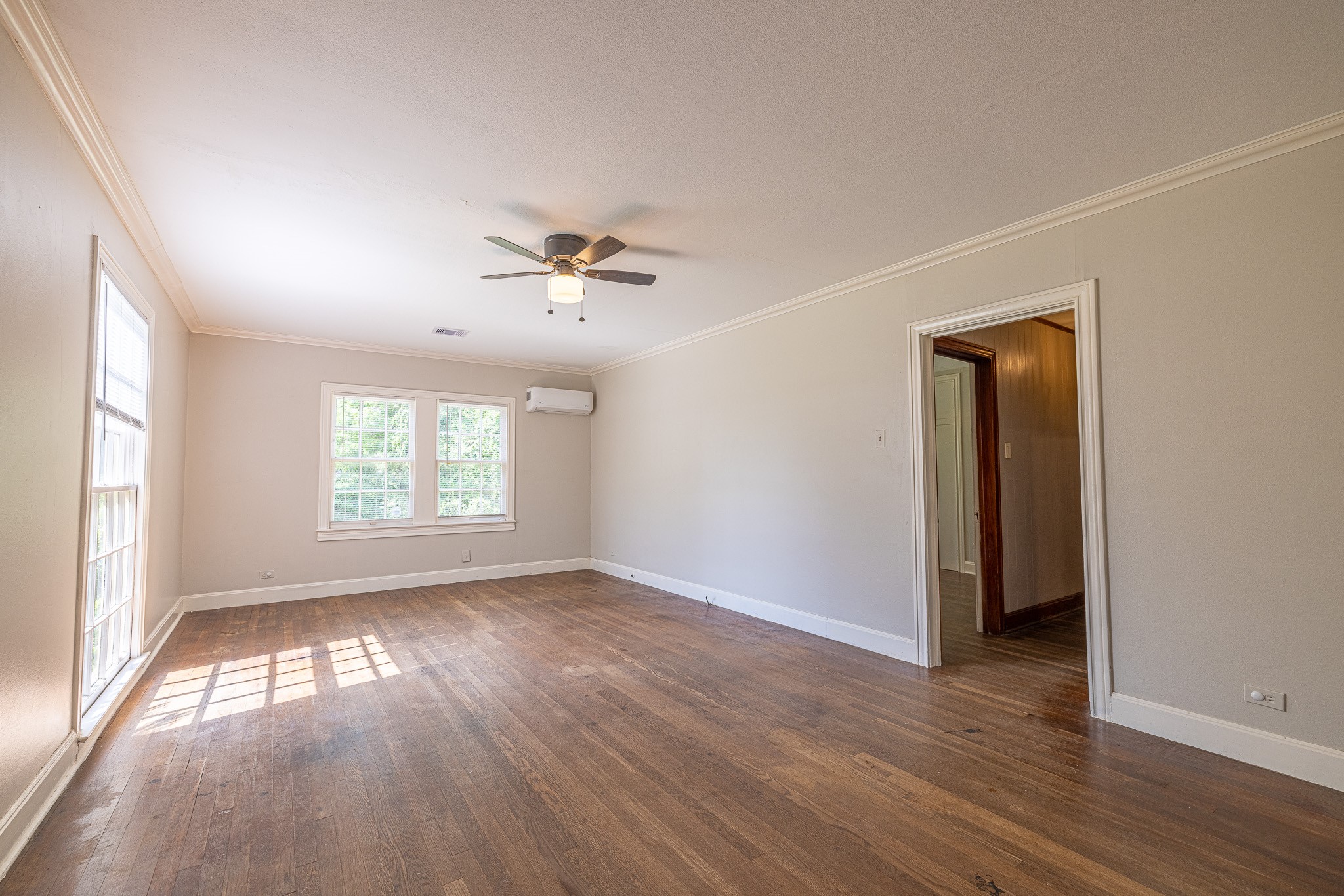 8548 Findlay Street Houston, TX 77017 - Photo 6 of 50 a view of empty room with wooden floor and fan