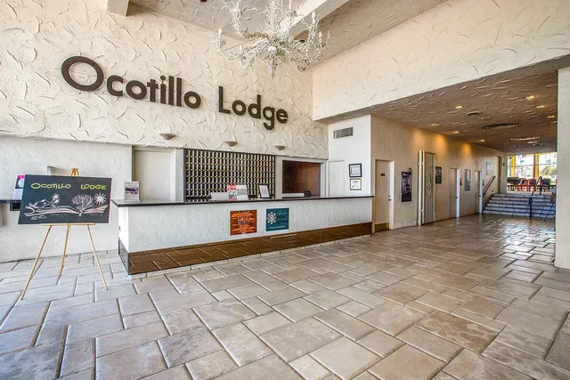 a room with pool table and outdoor seating