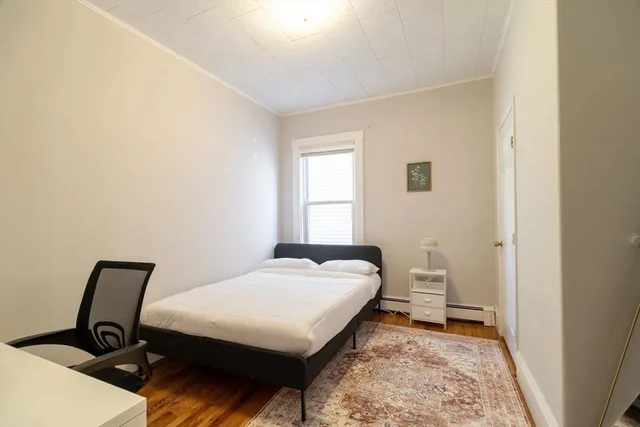 a bed room with a bed and a window