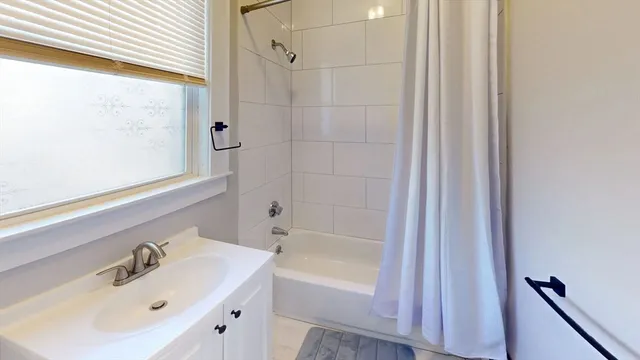 a bathroom with a sink and a bathtub