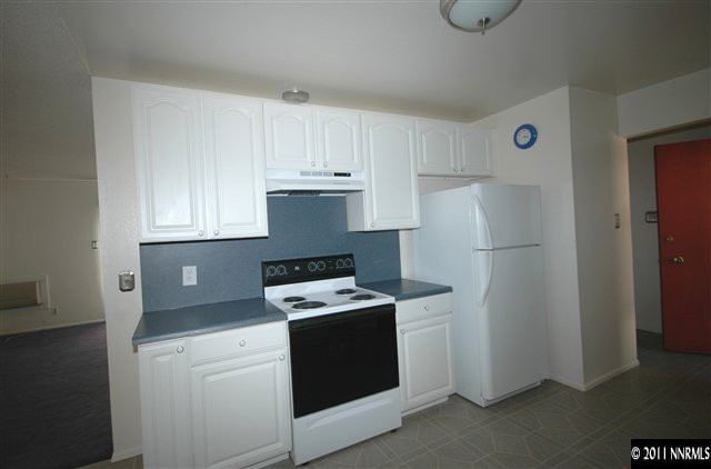 3630 West 7th Street Reno, NV 89503 - Photo 3 of 7 a kitchen with a refrigerator and a stove