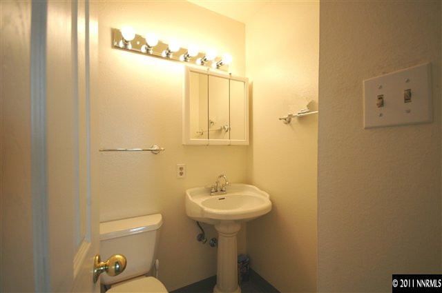 3630 West 7th Street Reno, NV 89503 - Photo 5 of 7 a bathroom with a sink a toilet and shower