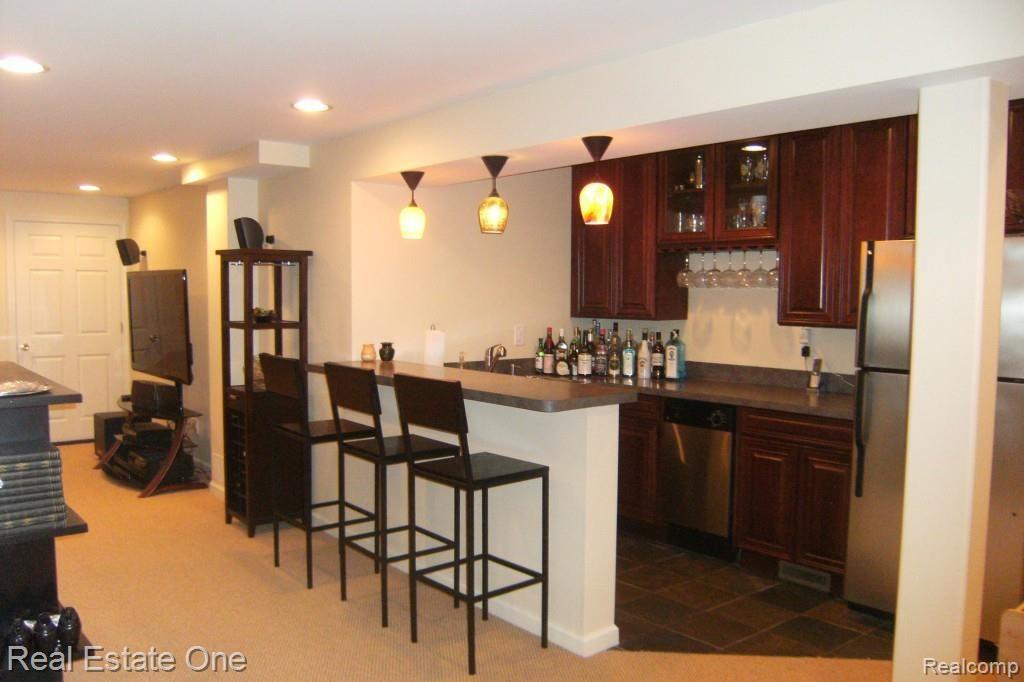 3133 East Maple Road Wixom, MI 48393 - Photo 25 of 37 Incredible Lower Level for Entertaining