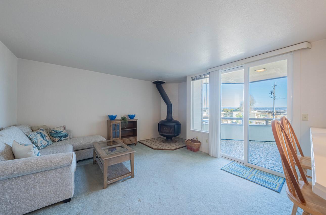 585 Hawthorne Street, Unit 103 Monterey, CA 93940 - Photo 8 of 30 a living room with furniture and a gym equipment