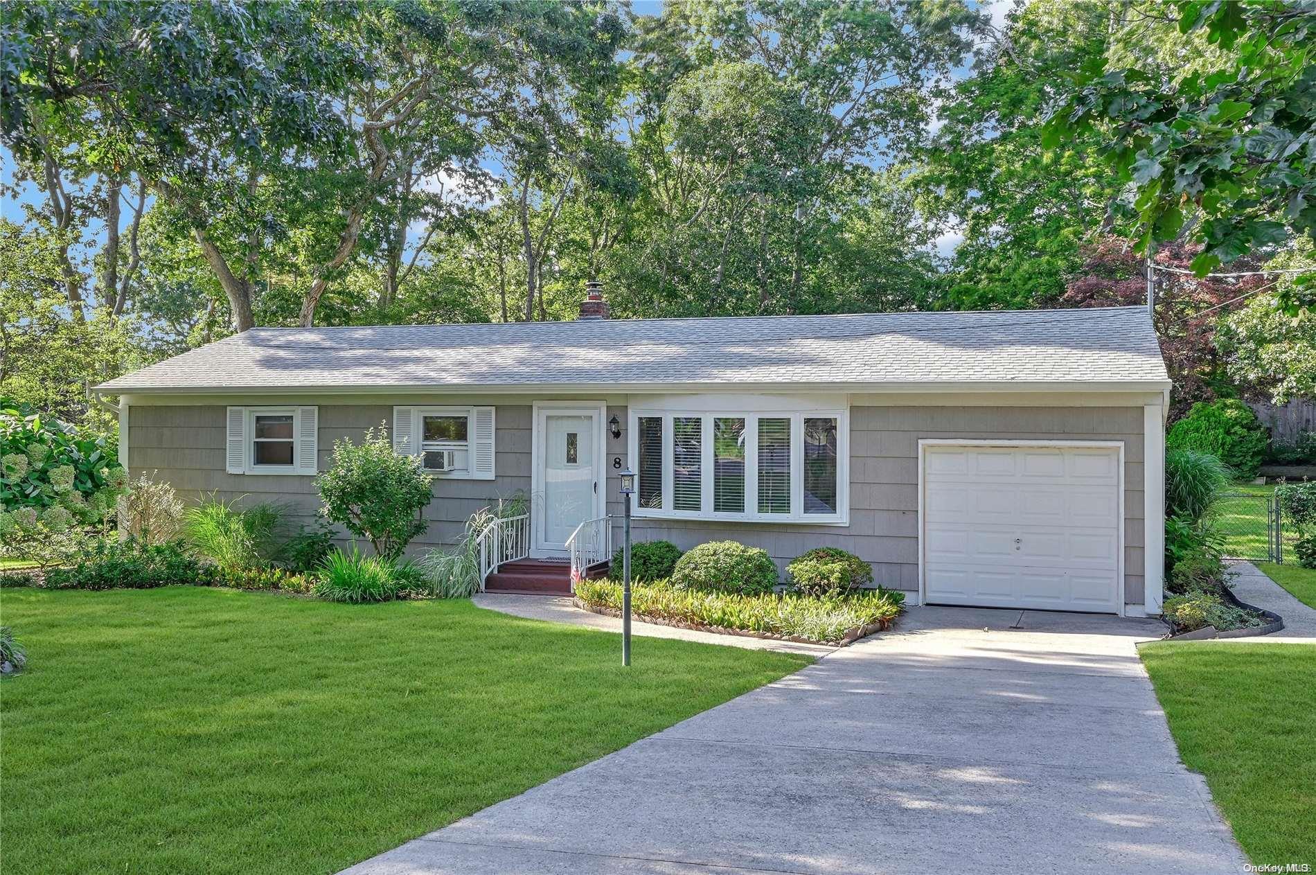 Undisclosed Address Hampton Bays, NY 11946 - Photo 1 of 1 a view of a house with a yard and plants