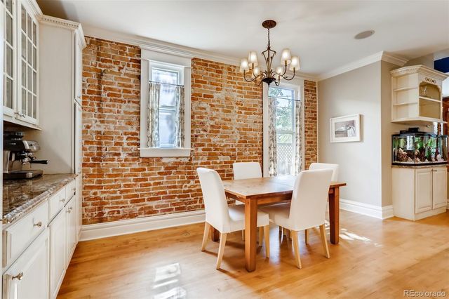 a large kitchen with a table and chairs in it