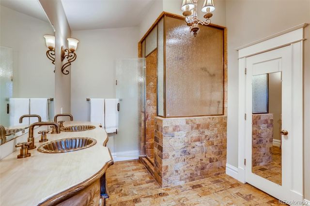 a bathroom with a sink mirror and toilet