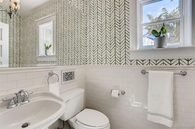 a living room with furniture and a book shelf