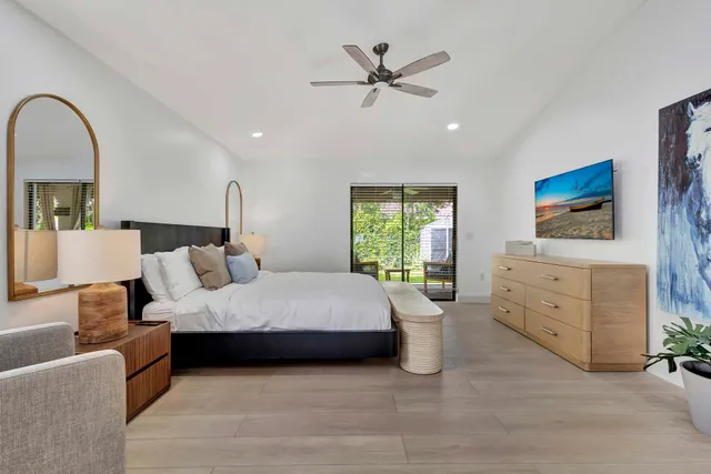 a bathroom with a bathtub a sink and a mirror