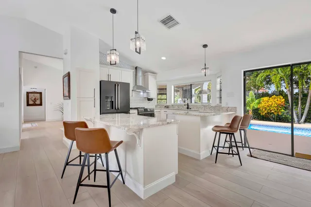 a living room with furniture a flat screen tv and a window