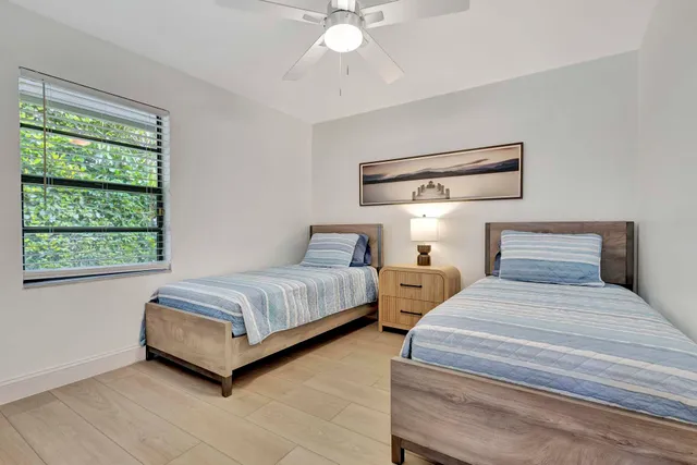 a view of a porch with chairs and a table
