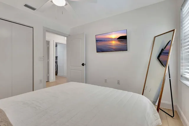 a view of a patio with table and chairs potted plants with wooden floor