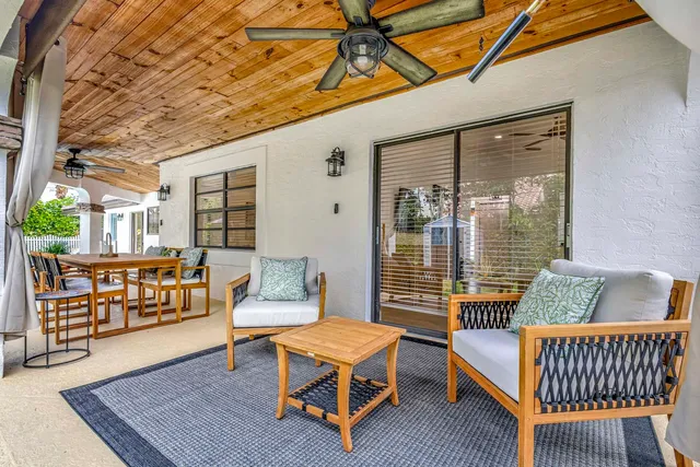 a view of a patio with swimming pool table and chairs
