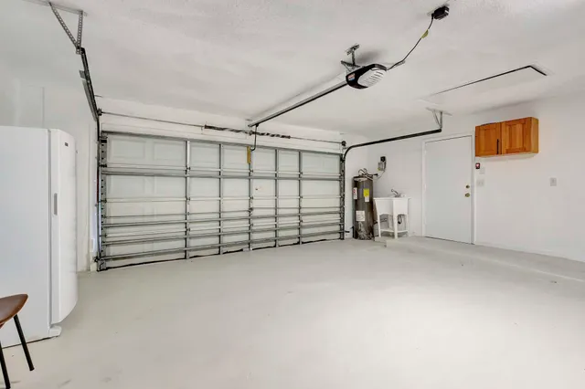 an aerial view of a house with garden space and street view