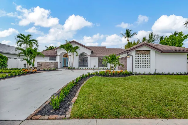 a view of houses with yard