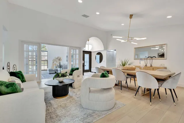 a bed room with furniture and a flat screen tv