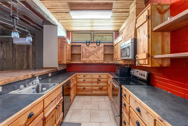 a view of a kitchen with a large window