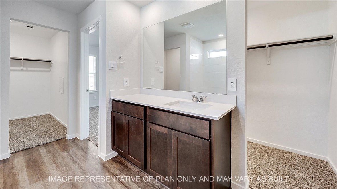 5539 Harriet Street Bryan, TX 77807 - Photo 11 of 17 a bathroom with a sink and mirror
