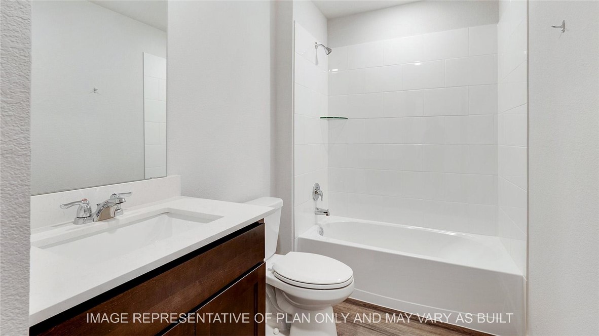 5539 Harriet Street Bryan, TX 77807 - Photo 14 of 17 a bathroom with a sink toilet and shower