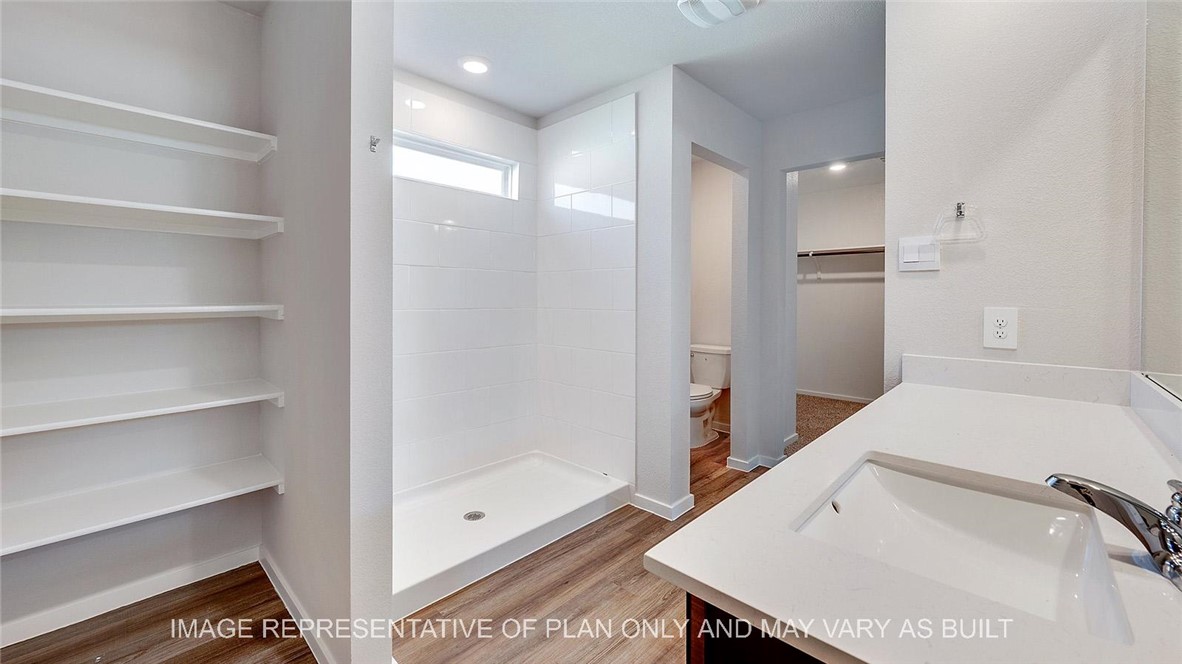 5539 Harriet Street Bryan, TX 77807 - Photo 10 of 17 a bathroom with a bathtub and a shower