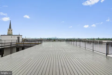 a view of a balcony with wooden floor
