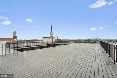 a view of a terrace with wooden floor and seating space