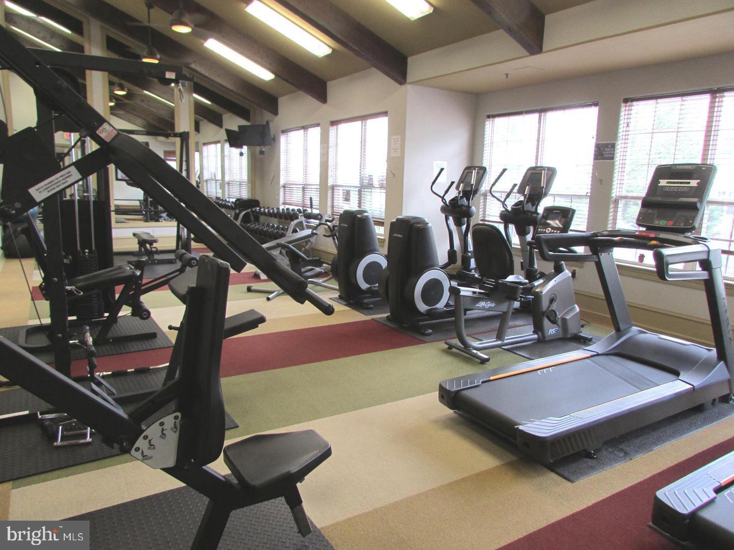 12945 Centre Park Circle, Unit 403 Herndon, VA 20171 - Photo 16 of 23 a room with gym equipment and windows