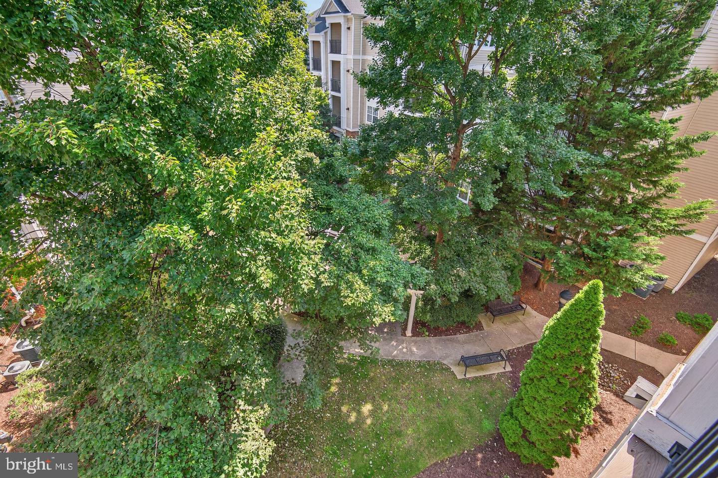 12945 Centre Park Circle, Unit 403 Herndon, VA 20171 - Photo 3 of 23 a view of a garden