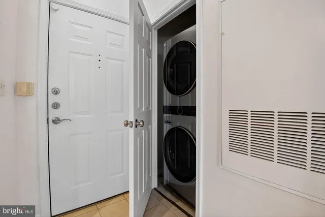 a view of a hallway with washer and dryer