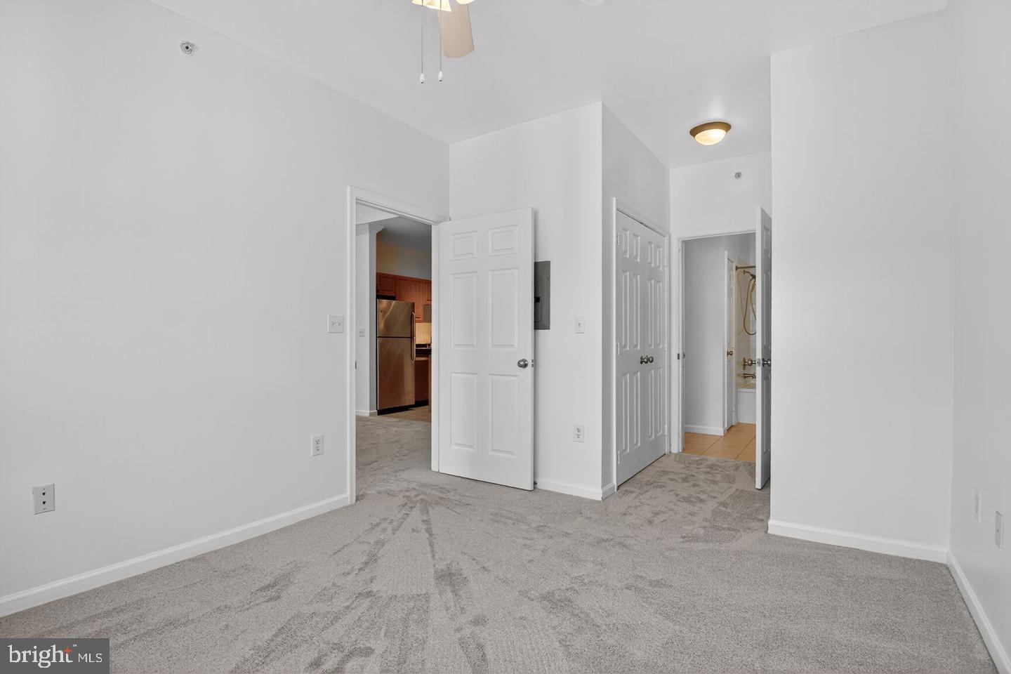 12945 Centre Park Circle, Unit 403 Herndon, VA 20171 - Photo 10 of 23 an empty room with closet and a hallway