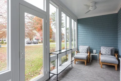 a kitchen with granite countertop a sink and wooden cabinets