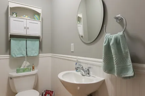 a view of a livingroom with furniture and a potted plant