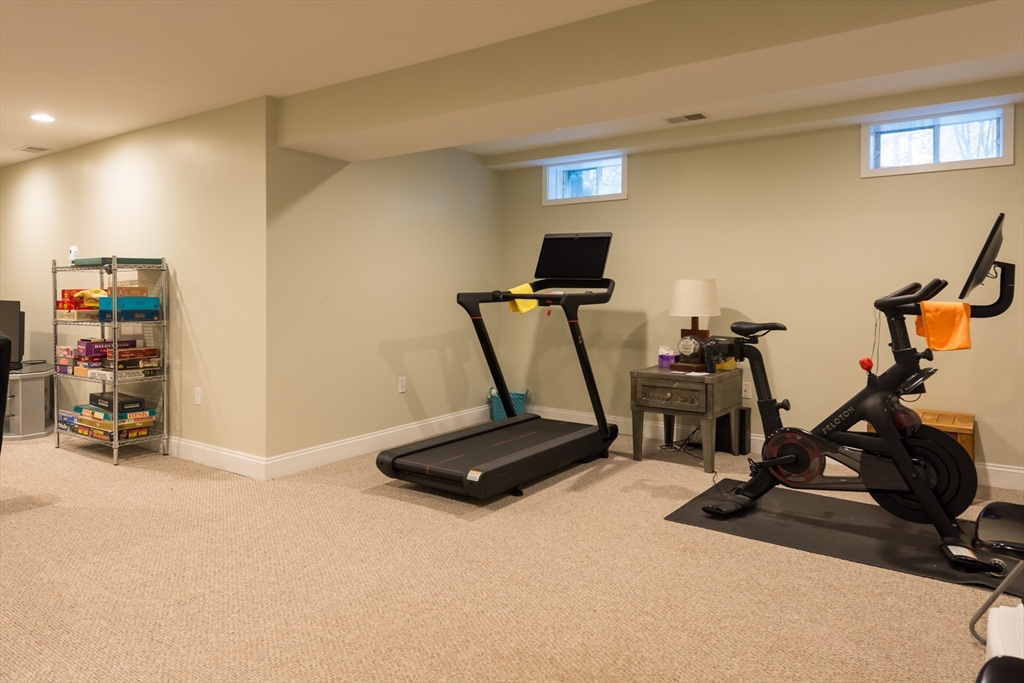 9 Hathaway Pond Circle, Unit 9 Rochester, MA 02770 - Photo 27 of 38 a view of a room with gym equipment