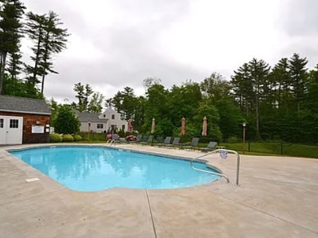 9 Hathaway Pond Circle, Unit 9 Rochester, MA 02770 - Photo 33 of 38 a view of a swimming pool with a yard